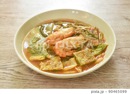 boiled shrimp and fried egg stuffed climbing wattle vegetable in spicy sour soup on plate boiled shrimp and fried egg stuffed climbing wattle vegetable in spicy sour soup on plate 90465099