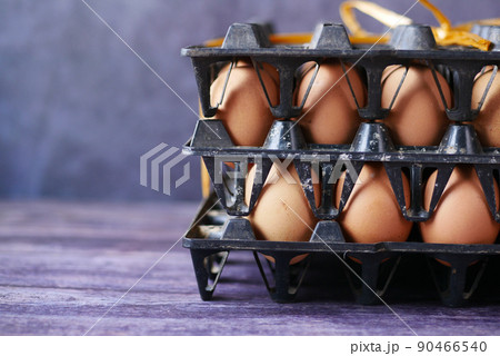 close up of eggs in a bowl. 90466540