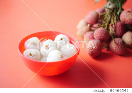 Lychee fruits in a red color bowl  90466543