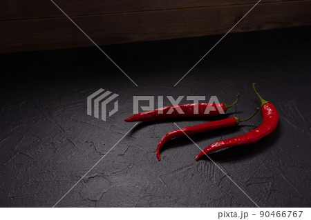 Chilly pepper for homemade cooking at table. Chilli pepper on tabletop 90466767