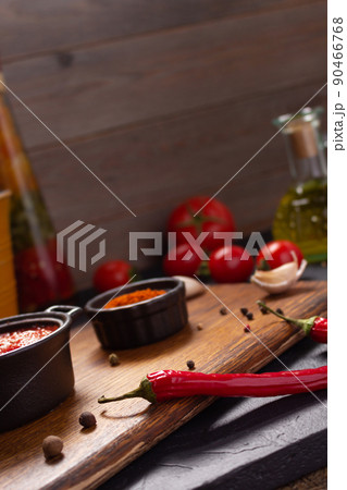 Chilli pepper and tomato sauce ingredient for homemade cooking on table. Chilly and recipe concept Chilli pepper and tomato sauce ingredient for homemade cooking on table. Chilly and recipe concept 90466768