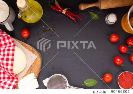 Pizza and dough homemade cooking with ingredients on table. Pizza with sauce at tabletop 90466802