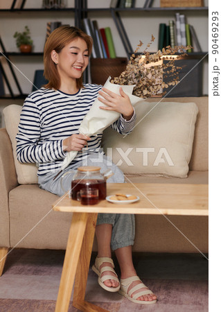 Woman with Bouquet of Dried Flowers Woman with Bouquet of Dried Flowers 90469293