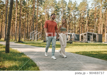 Couple in love strolling in the park 90469737