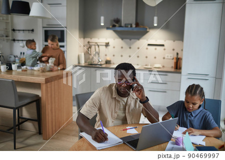 Father Working from Home Biracial Family 90469997