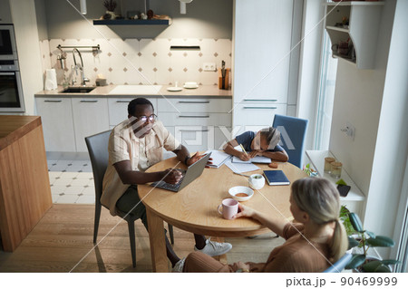 Biracial Family at Table High Angle Biracial Family at Table High Angle 90469999