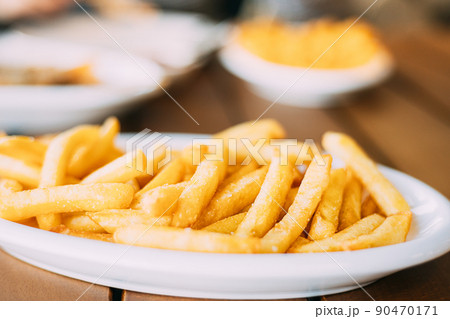 french fries on plate. street food, snacks french fries on plate. street food, snacks 90470171