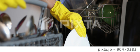 Persons hand in glove take plate Persons hand in glove take plate 90470383