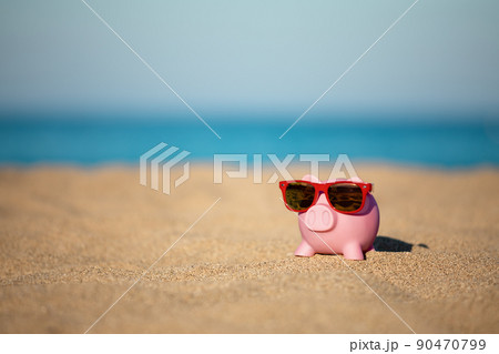 Piggybank on the beach in summer 90470799