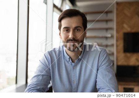 Head shot of confident friendly business professional looking at camera Head shot of confident friendly business professional looking at camera 90471014