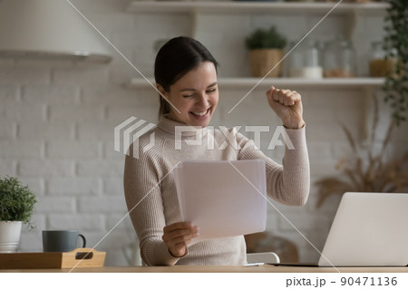 Excited euphoric student girl receiving admission letter from school 90471136