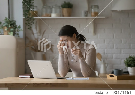 Frustrated tired laptop user woman feeling overworked, exhausted Frustrated tired laptop user woman feeling overworked, exhausted 90471161