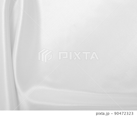 Smooth elegant white silk or satin luxury cloth texture as wedding background. Luxurious background design Smooth elegant white silk or satin luxury cloth texture as wedding background. Luxurious background design 90472323