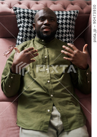 Above shot of young black man in casualwear explaining his problems 90473930