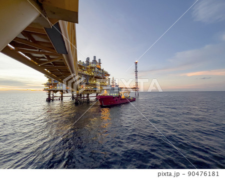 Offshore construction platform for production oil and gas. Oil and gas industry and hard work. Production platform and operation process by manual and auto function from control room. 90476181