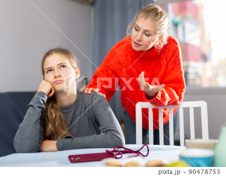 Sad teen girl after discord with her mother 90478753