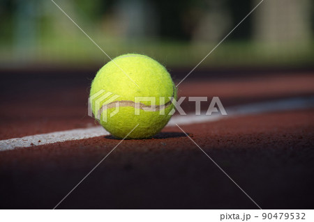 Tennis scene with white line and ball and racquets 90479532