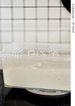 The process of making wheat bread at home. The concept of healthy homemade food. Vertical photo. 90480853