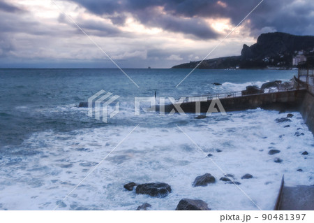 Storm at sea with waves during rain and cloudy in Alupka. Crimea Storm at sea with waves during rain and cloudy in Alupka. Crimea 90481397