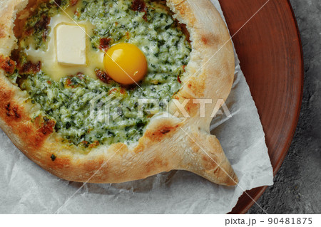 Some khachapuri traditional Georgian homemade cheese and spinach pies on the plate 90481875