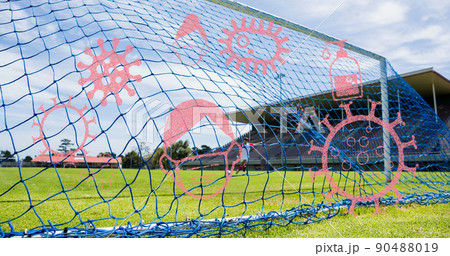 Coronavirus concept icons against man kicking soccer ball Coronavirus concept icons against man kicking soccer ball 90488019