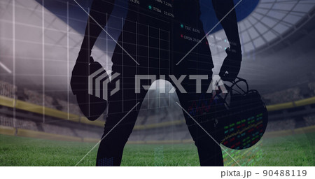 Image of graphs and data processing over midsection of american football player at sport stadium Image of graphs and data processing over midsection of american football player at sport stadium 90488119