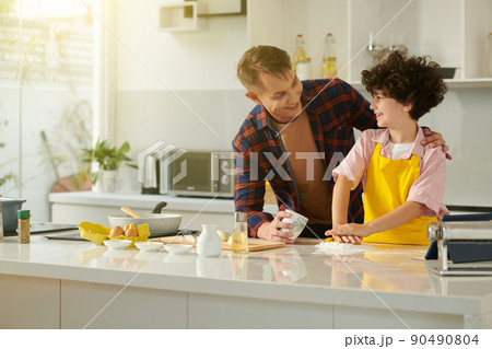 Dad amd Son Making Dough Dad amd Son Making Dough 90490804
