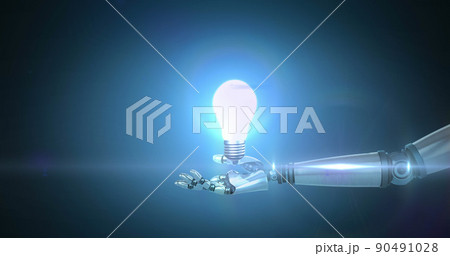Image of illuminated light bulb over hand of robot arm, with moving light on blue background Image of illuminated light bulb over hand of robot arm, with moving light on blue background 90491028