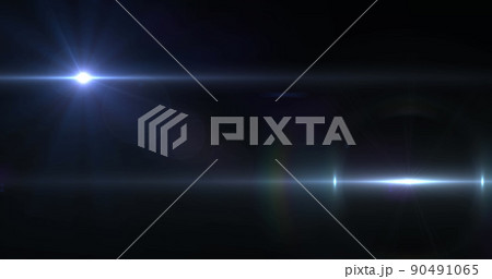 Image of two beams of white light moving across black background 90491065