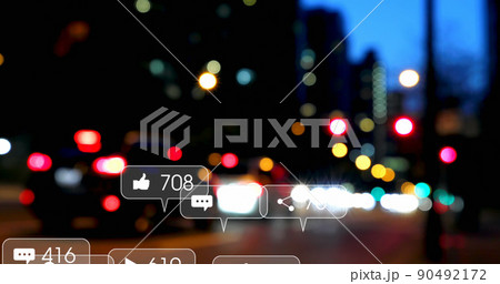Image of social media icons and numbers over out of focus traffic lights Image of social media icons and numbers over out of focus traffic lights 90492172