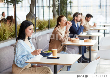 People in Row at Food Court 90495743