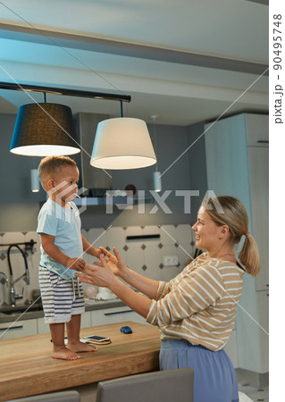 Mother Playing with Baby in Biracial Family 90495748