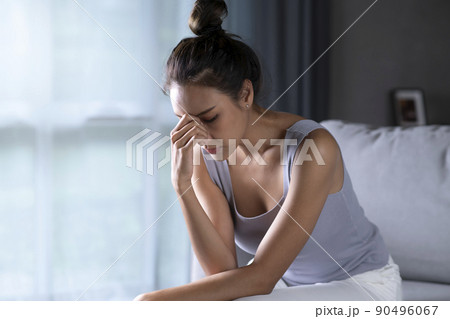Asian woman feeling sad tired and worried suffering depression in mental health Asian woman feeling sad tired and worried suffering depression in mental health 90496067