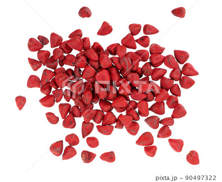 Annatto seeds, isolated on a white background. Achiote seeds, bixa orellana. Natural dye for cooking and food. Close-up. Top view. 90497322