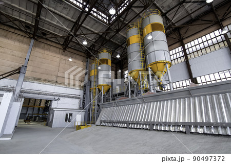 plant for production and mix concrete with containers for cement and sand for automatic mixing of mixture, warehouse hangar with tank for bulk plant for production of concrete products, nobody. plant for production and mix concrete with containers for cement and sand for automatic mixing of mixture, warehouse hangar with tank for bulk plant for production of concrete products, nobody. 90497372