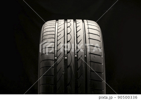 new summer tire on a black background, front view 90500336