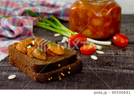 Home caviar tomato and beans on the wooden table dark Home caviar tomato and beans on the wooden table dark 90500691
