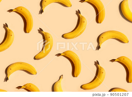 Yellow bananas pattern on a trendy beige background. Summer freshness, natural snack, organic. Healthy eating, raw food, vegan vitamins food concept. Bright abstract backdrop or wallpaper 90501207