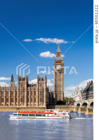 Famous Big Ben with bridge over Thames and tourboat on the river in London, England, UK 90501222