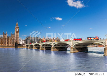 Famous Big Ben with red buses on bridge over Thames river in London, England, UK Famous Big Ben with red buses on bridge over Thames river in London, England, UK 90501224
