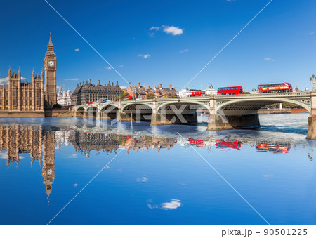 Famous Big Ben with red buses on bridge over Thames river in London, England, UKK 90501225