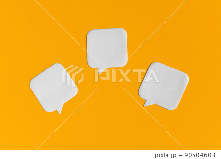 Three white blank stickers on yellow paper background. Back to school, office supplies, stationery mockup minimalistic concept. Empty paper notes template for your logo, message 90504603