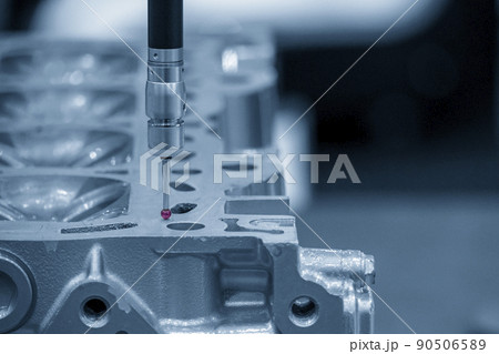 The  CMM machine measuring the cylinder head parts . 90506589