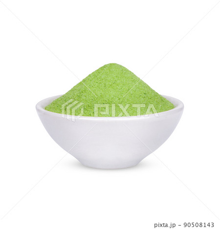 Green tea powder in a white cup isolated on white background Green tea powder in a white cup isolated on white background 90508143