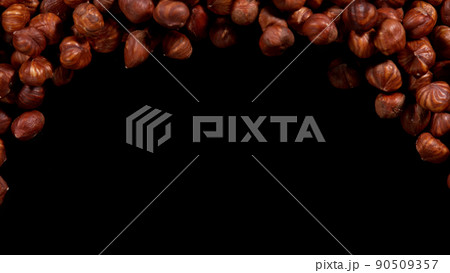 Hazelnuts isolated on black background. 90509357