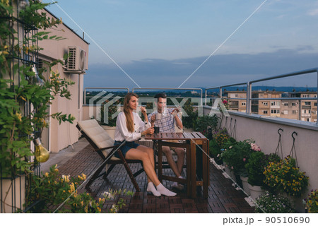 Couple Enjoying On Rooftop Garden 90510690