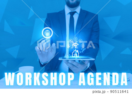 Hand writing sign Workshop Agenda. Word Written on helps you to ensure that your place stays on schedule Man holding Screen Of Mobile Phone Showing The Futuristic Technology. 90511641