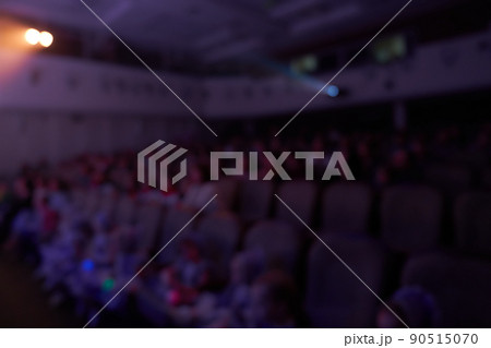 Event hall with chairs on a blurry background. The audience of a music concert hall or a conference hall for seminars in the educational and creative business. High quality photo 90515070