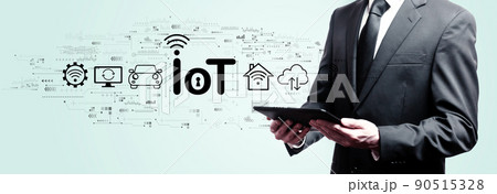 IoT theme with businessman holding a tablet 90515328