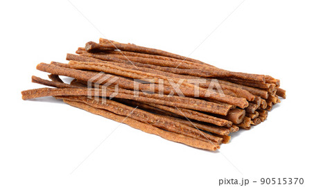 Brown sticks food for animals. Dog treat isolated on white background Brown sticks food for animals. Dog treat isolated on white background 90515370